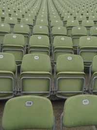 Full frame shot of empty folding chairs at stadium