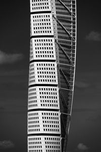 Low angle view of buildings against cloudy sky