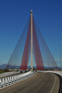 Low angle view of bridge against clear blue sky