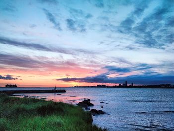 Scenic view of sea against dramatic sky