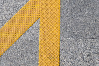 High angle view of yellow zebra crossing on road