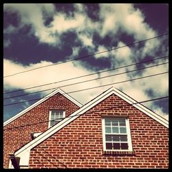 High section of building against cloudy sky