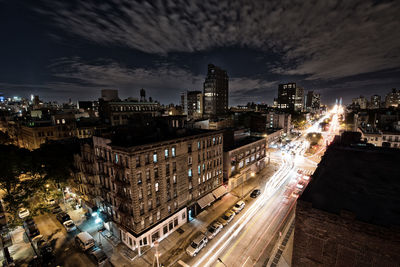 High angle view of illuminated buildings in city at night