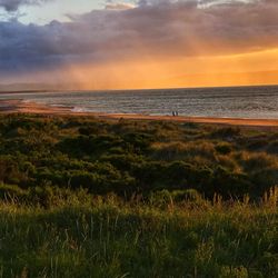 Scenic view of sea against sky during sunset