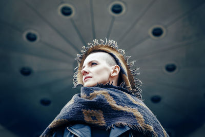 Portrait of young woman looking away in winter