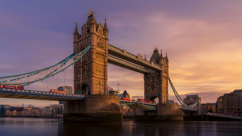 View of bridge over river against cloudy sky