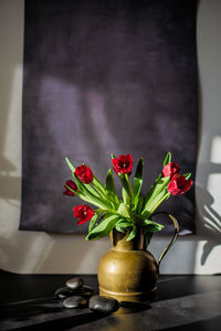 Close-up of flowers red tulips on table 