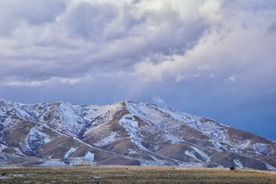 Oquirrh mountain range snow capped, bingham canyon mine kennecott copper mine salt lake utah. usa.