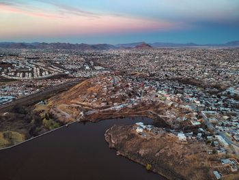 High angle view of river amidst buildings in city