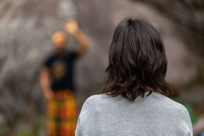 Rear view of couple standing against blurred background