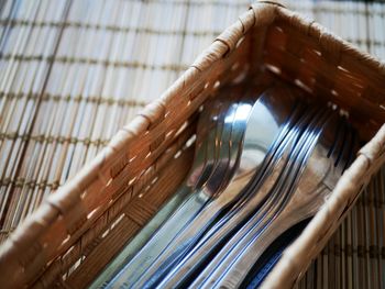 High angle view of paintbrushes on wicker basket