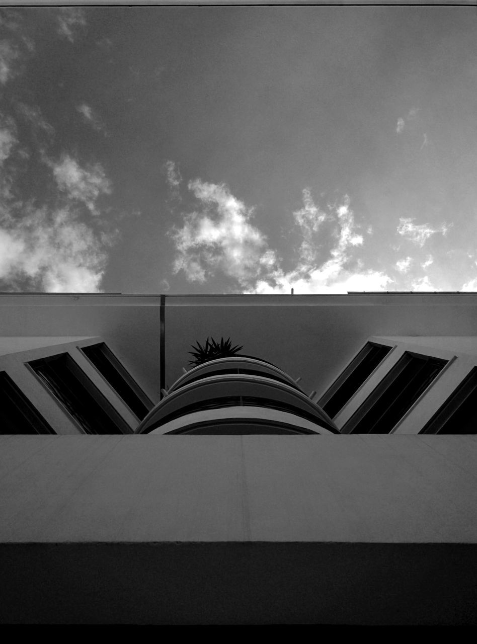 architecture, low angle view, built structure, sky, building exterior, cloud - sky, modern, cloud, building, cloudy, day, office building, no people, outdoors, railing, window, city, architectural feature, pattern, glass - material