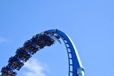 Low angle view of rollercoaster against sky