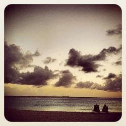 Scenic view of sea against sky at sunset