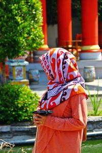 Woman looking away while wearing traditional clothing