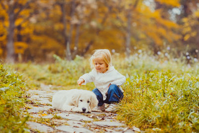 Cute baby girl standing in park