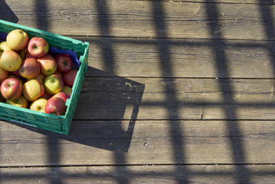 High angle view of fruits in crate on table