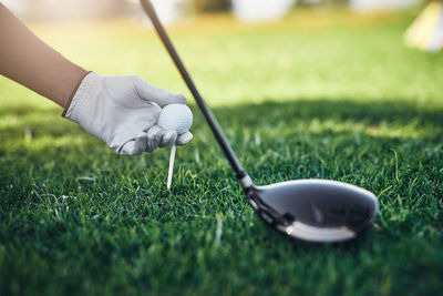 Low section of person playing golf