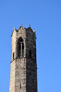 Low angle view of building against clear blue sky