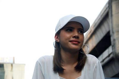 Portrait of young woman looking away