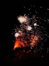 Firework display at night