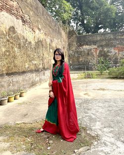 Bengali woman standing on the floor with traditional dress