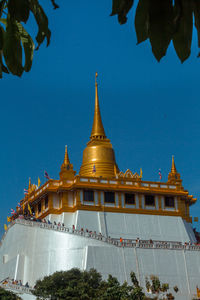 View of temple building against blue sky