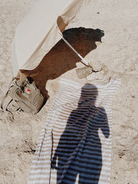 High angle view of shadow on sand at beach