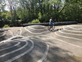 Man riding bicycle on road