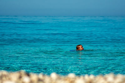 Swimming underwater in sea