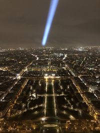 High angle view of city lit up at night