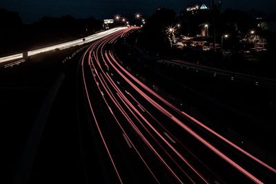 High angle view of light trails on highway at night