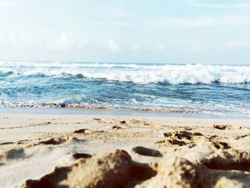 Surface level of beach against sky