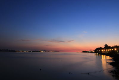 Scenic view of sea against sky at dusk