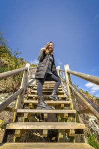 Low angle view of woman against sky