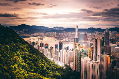 High angle view of buildings against cloudy sky