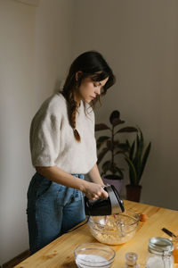 Young woman making christmas cookies