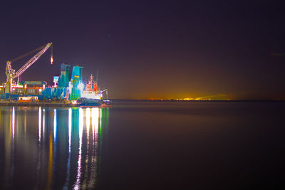 Scenic view of sea against sky at night