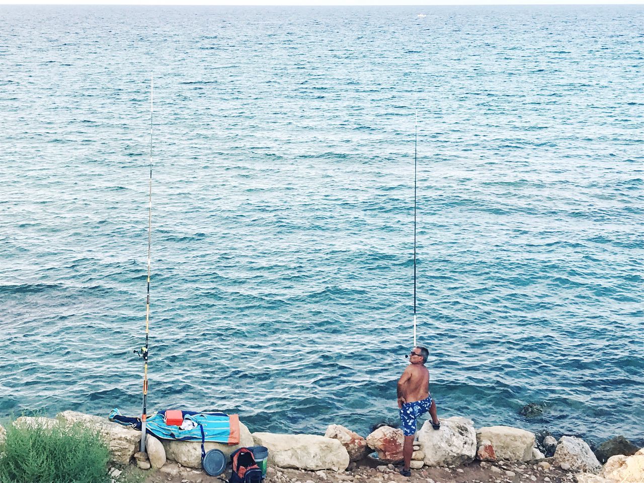 sea, water, real people, men, leisure activity, rod, nature, fishing, fishing rod, lifestyles, day, people, shirtless, beauty in nature, activity, scenics - nature, outdoors, rope, group of people, fisherman