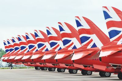 Red flag on car against sky