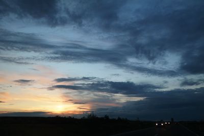 Scenic view of landscape against cloudy sky