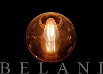 Low angle view of lit light bulb
