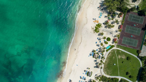 Aerial view of sea and tennis court