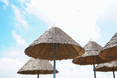 Low angle view of traditional windmill against sky