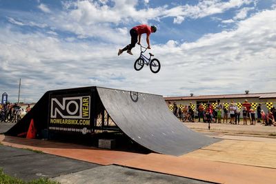 Low angle view of man jumping on stage