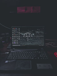 Digital composite image of laptop on table