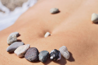 High angle view of stones on stomach showing a smiley