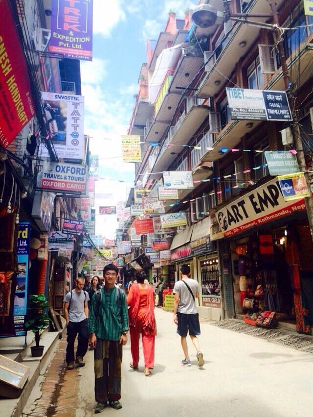 building exterior, street, architecture, built structure, walking, men, person, city, city life, lifestyles, large group of people, market, full length, store, text, casual clothing, leisure activity, road, city street