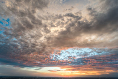 Low angle view of dramatic sky during sunset