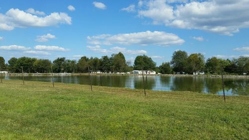 Scenic view of lake against cloudy sky